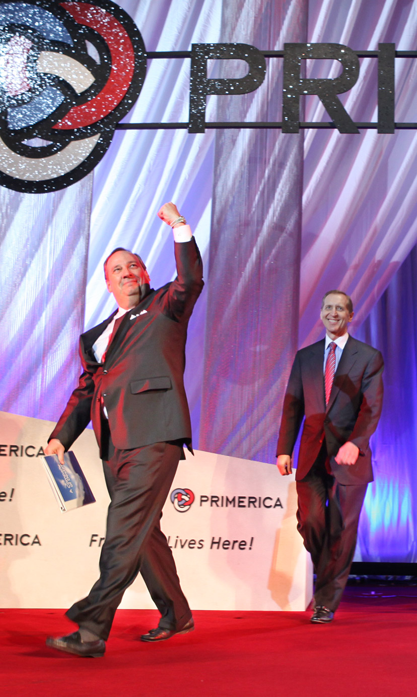 Man walking across stage at 2017 Primerica Convention