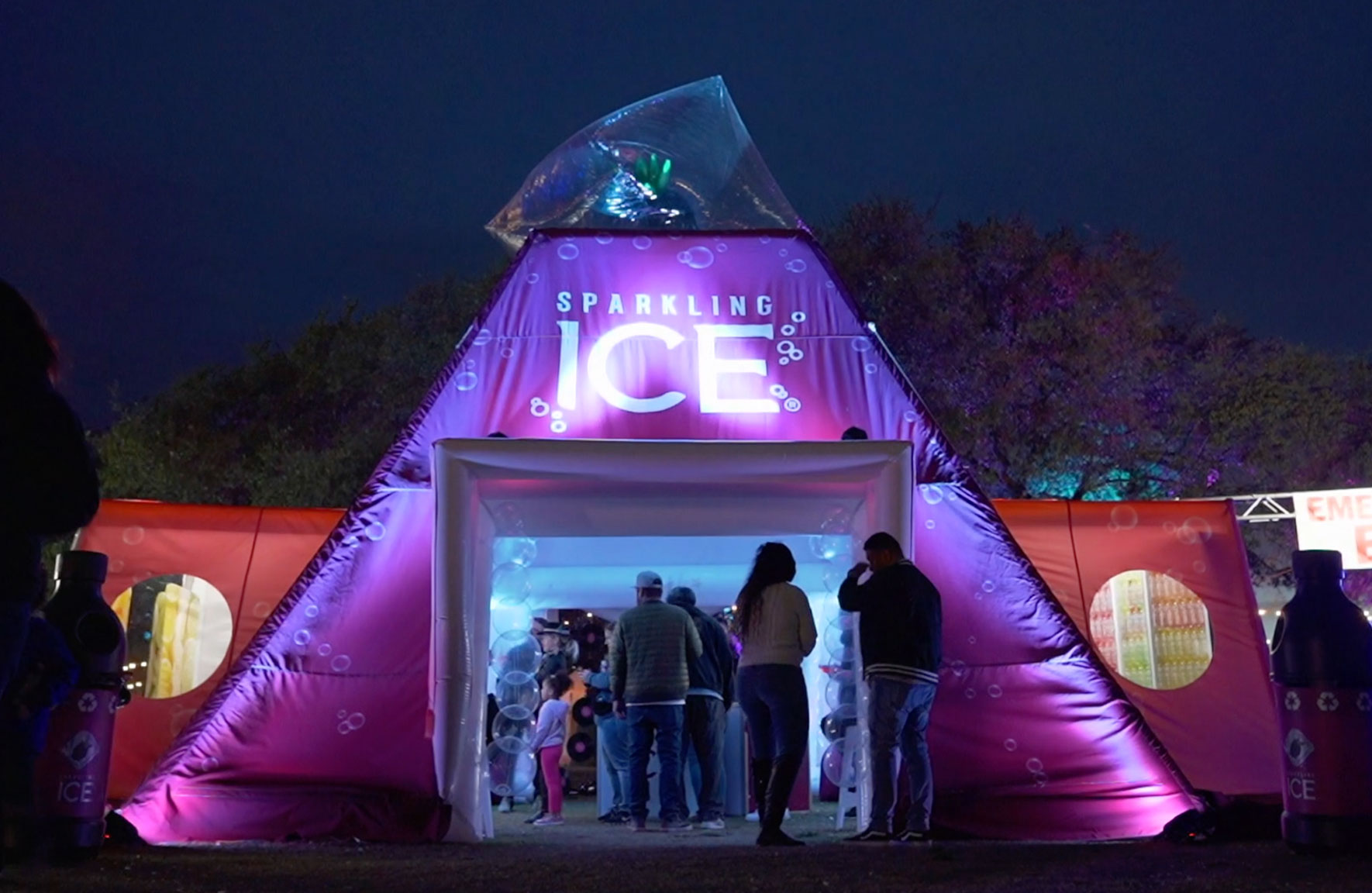 Sparkling ICE Inflatable tent with brand ambassadors at anight